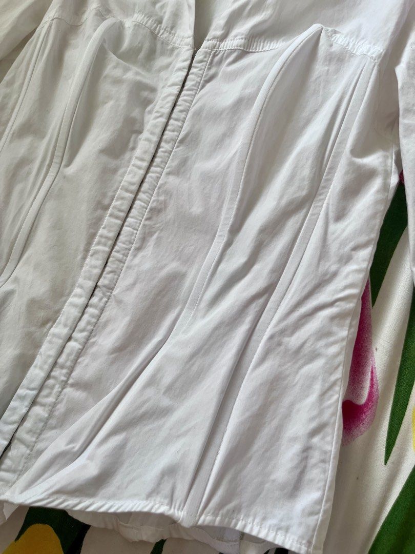 ZARA White Corset Style Button-Up Shirt (Category: Shirts) located in Manila. Submitted by oddstorm_9d6c74 (Listing ID 1441989760, Image 2). Description: - Zara white button-up shirt - Size S (estimated) - Corset-style fit with shaping darts - Long sleeves with button cuffs - Front zip closure.