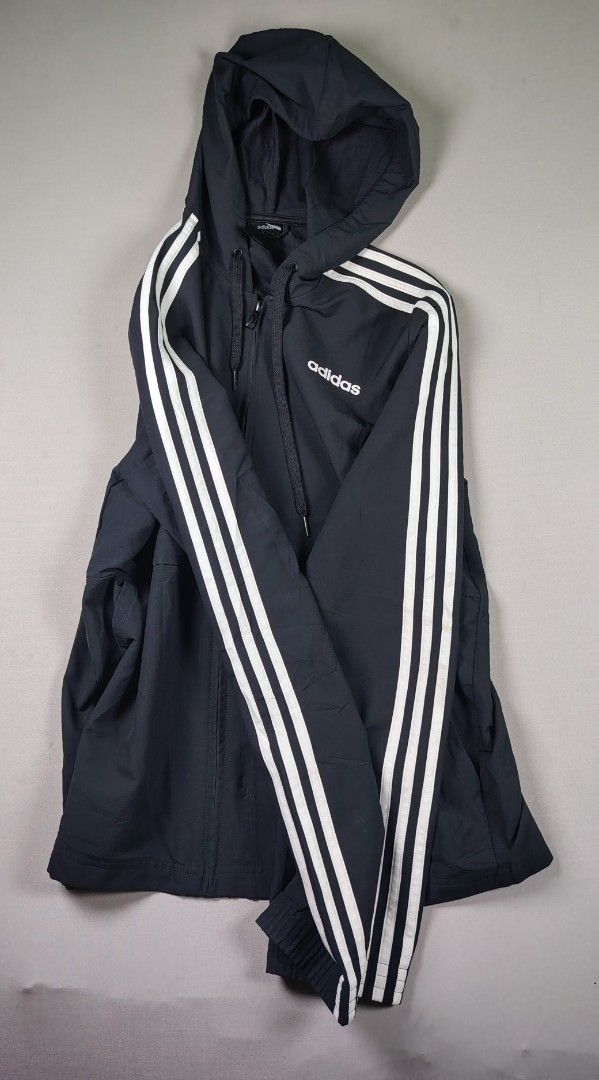Adidas Track Jacket with 3 Stripes (Category: Coats, Jackets and Outerwear) located in Manila. Submitted by carlitorep57860 (Listing ID 1442306030, Image 1). Description: - Classic black Adidas track jacket - Iconic three stripes down the sleeves - Full zip front - Attached hood - Ideal for sports or casual wear - Measurements available in photos - Please check pictures for detailed condition.
