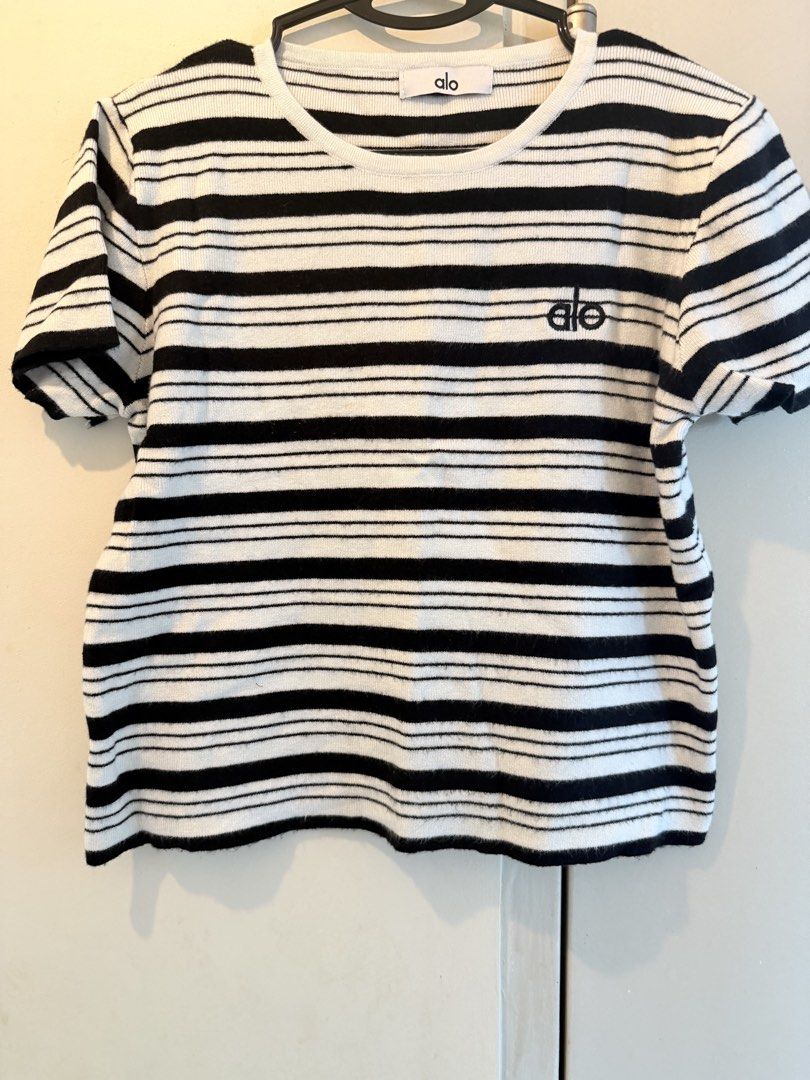 Alo Striped T-shirt (Bangkok) (Category: Shirts) located in Singapore. Submitted by blackvelma (Listing ID 1442193348, Image 3). Description: - Alo t-shirt - Black and white stripes - Embroidered Alo logo on chest - Short sleeves - Crew neck - Comfortable and casual - Perfect for everyday wear.
