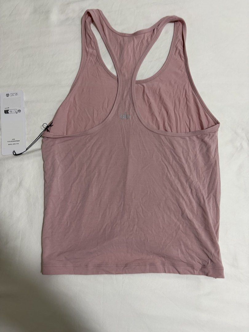Alo Yoga All Day Tank Top Dusty Rose XS/TP/ECH (Category: Activewear) located in Singapore. Submitted by carlitojuan (Listing ID 1442289669, Image 1). Description: - Brand: Alo Yoga - Style: All Day Tank - Color: Dusty Rose - Material: 93% Modal, 7% Elastane - Features: Super soft, stretchy fabric, racerback design - Perfect for: Workouts or casual wear - Condition: New with tags attached - Meet up Tg Katong area Mailing included.