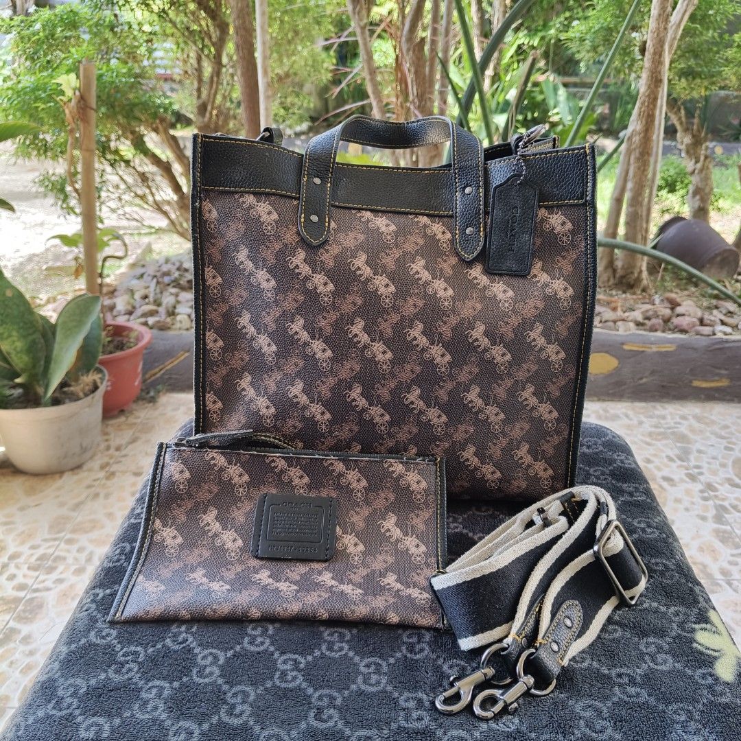 Authentic Coach Field Tote with Matching Pouch & Strap Set (Category: Luxury Bags & Wallets) located in Iloilo. Submitted by bellabeigefinds (Listing ID 1442257599, Image 1). Description: Selling a beautiful, complete Coach Field Tote Set in the iconic dark brown Horse and Carriage print with black pebble leather trim and contrast yellow stitching. Highly versatile and spacious, perfect for daily use, work, or school! What’s Included: •Main Field