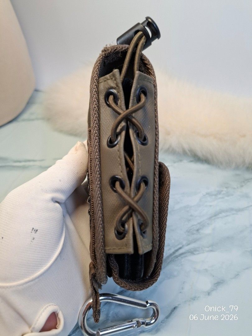 AVIREX USA Pouch with Carabiner (Category: Belt bags, Clutches and Pouches) located in Pasay City. Submitted by onick_79 (Listing ID 1442210253, Image 3). Description: This is an Avirex U.S.A. branded tactical mag pouch.It features a coyote brown mesh and fabric construction with lace-up side retention.The pouch is designed for attaching to MOLLE systems or belts for quick magazine access - Brand: AVIREX USA - Color: Brown - Features: Mesh sectio