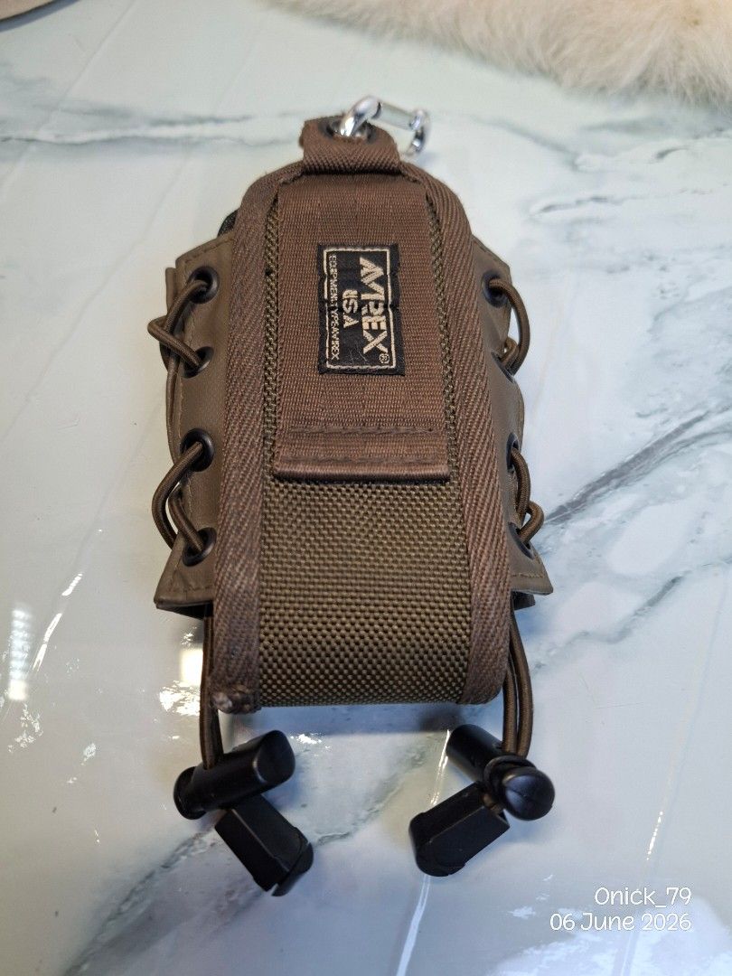 AVIREX USA Pouch with Carabiner (Category: Belt bags, Clutches and Pouches) located in Pasay City. Submitted by onick_79 (Listing ID 1442210253, Image 2). Description: This is an Avirex U.S.A. branded tactical mag pouch.It features a coyote brown mesh and fabric construction with lace-up side retention.The pouch is designed for attaching to MOLLE systems or belts for quick magazine access - Brand: AVIREX USA - Color: Brown - Features: Mesh sectio