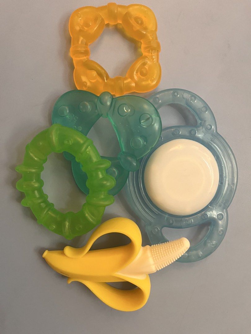 Baby Teethers and Training Spoons Set (Category: Weaning & Toddler Feeding) located in Manila. Submitted by freecrystal.28ce36 (Listing ID 1442231822, Image 2). Description: - All teethets are bought in SM dept store. -Set includes banana teether, ring teethers, and 2 training spoons (green & white). - Ideal for soothing sore gums during teething. - Encourages baby's first steps towards self-feeding. - All items are thoroughly cleaned and sanitiz