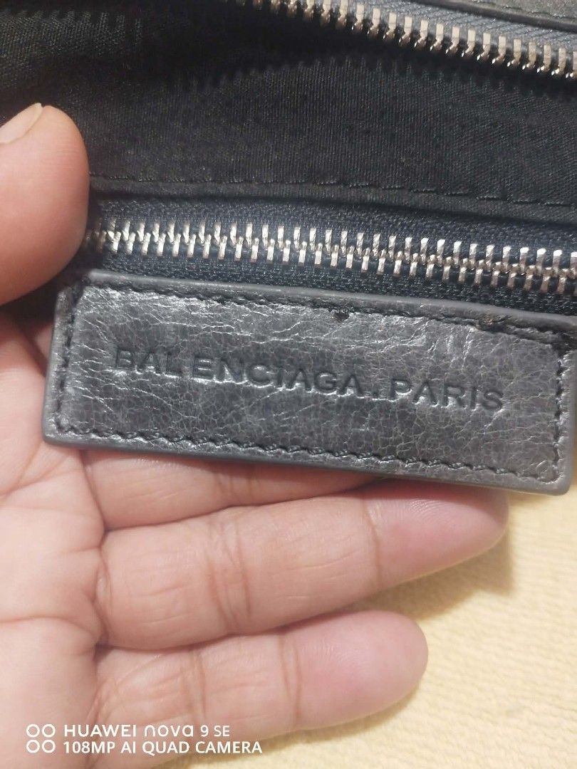 Balenciaga Paris Leather Handbag (Category: Luxury Bags & Wallets) located in Cebu City. Submitted by tlisurplus (Listing ID 1442290758, Image 2). Description: - Balenciaga Paris handbag - Color: Grey - Material: Distressed leather - Features: Braided handle, detachable shoulder strap, interior zip pocket - Origin: Made in Italy - Serial Number: 173082-200047.