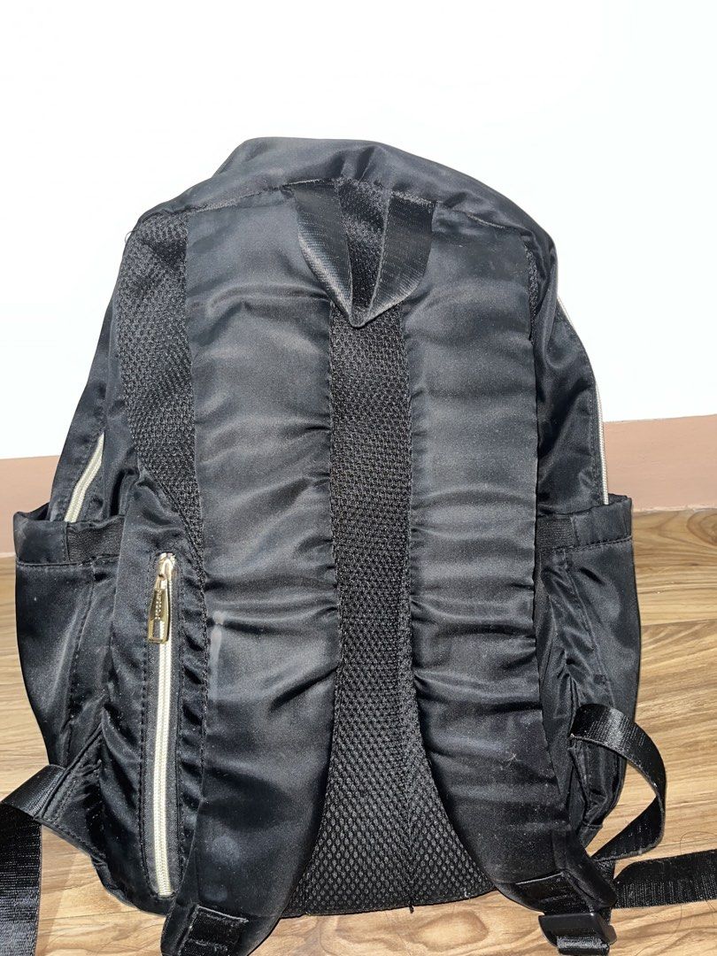 Black Nylon Backpack with Multiple Pockets (Category: Backpacks) located in Manila. Submitted by ezxraax (Listing ID 1442290262, Image 2). Description: - Durable black nylon backpack - Main compartment for storage - Front zip pocket for essentials - Convenient side pockets - Padded straps and back for maximum comfort - Ideal for school, work, or everyday use - Zippers are fully functional.