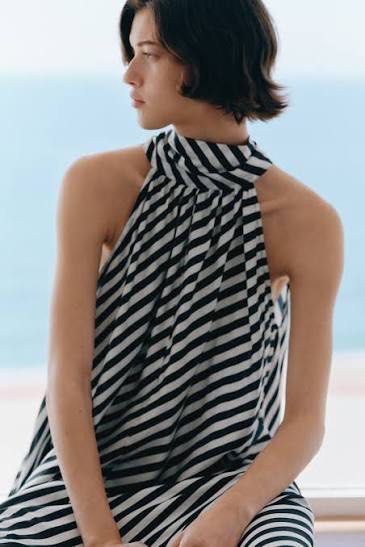 Blue Maxi Dress (Category: Dresses) located in Manila. Submitted by paperthread (Listing ID 1442232983, Image 2). Description: - Long flowing maxi dress - Bold black and white stripe pattern - Halter neckline with tie-back - Beautifully draping fabric - Ideal for beach vacations or summer evenings - Comfortable and stylish - size XS but fits up to Medium frame - perfect for wedding guests on beach or summer themed parties - bought at ₱2,990.