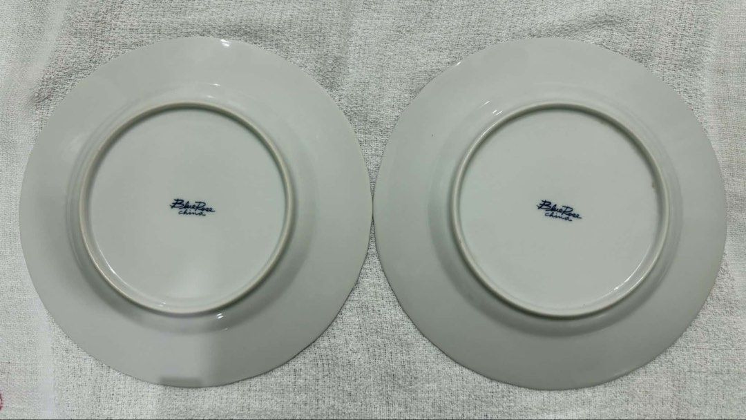 Blue Rose China Breakfast Plates - Scalloped Edge (Category: Dinnerware & Cutlery) located in Manila. Submitted by arichives (Listing ID 1442320839, Image 3). Description: -Blue Rose China Breakfast Plates - Scalloped Edge -Set of 2 -Origin: Made in China -Design: Beautiful blue rose botanical print on white ceramic plate. -Condition: Excellent vintage condition. No visible chips, cracks, or staining..