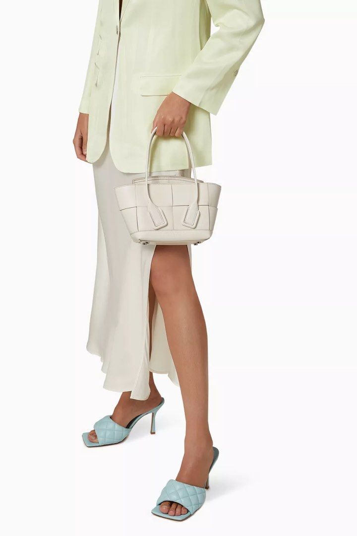 Bottega Veneta Mini Arco Tote (Category: Luxury Bags & Wallets) located in Taguig. Submitted by sourcedbym (Listing ID 1442204706, Image 3). Description: Retail 128k Comes complete with cards and dustbag Has extra strap for crossbody Minor rubbings on the back but otherwise excellent condition.