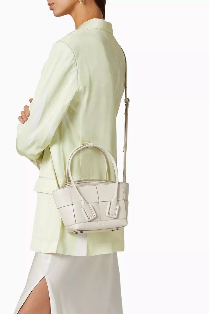 Bottega Veneta Mini Arco Tote (Category: Luxury Bags & Wallets) located in Taguig. Submitted by sourcedbym (Listing ID 1442204706, Image 1). Description: Retail 128k Comes complete with cards and dustbag Has extra strap for crossbody Minor rubbings on the back but otherwise excellent condition.