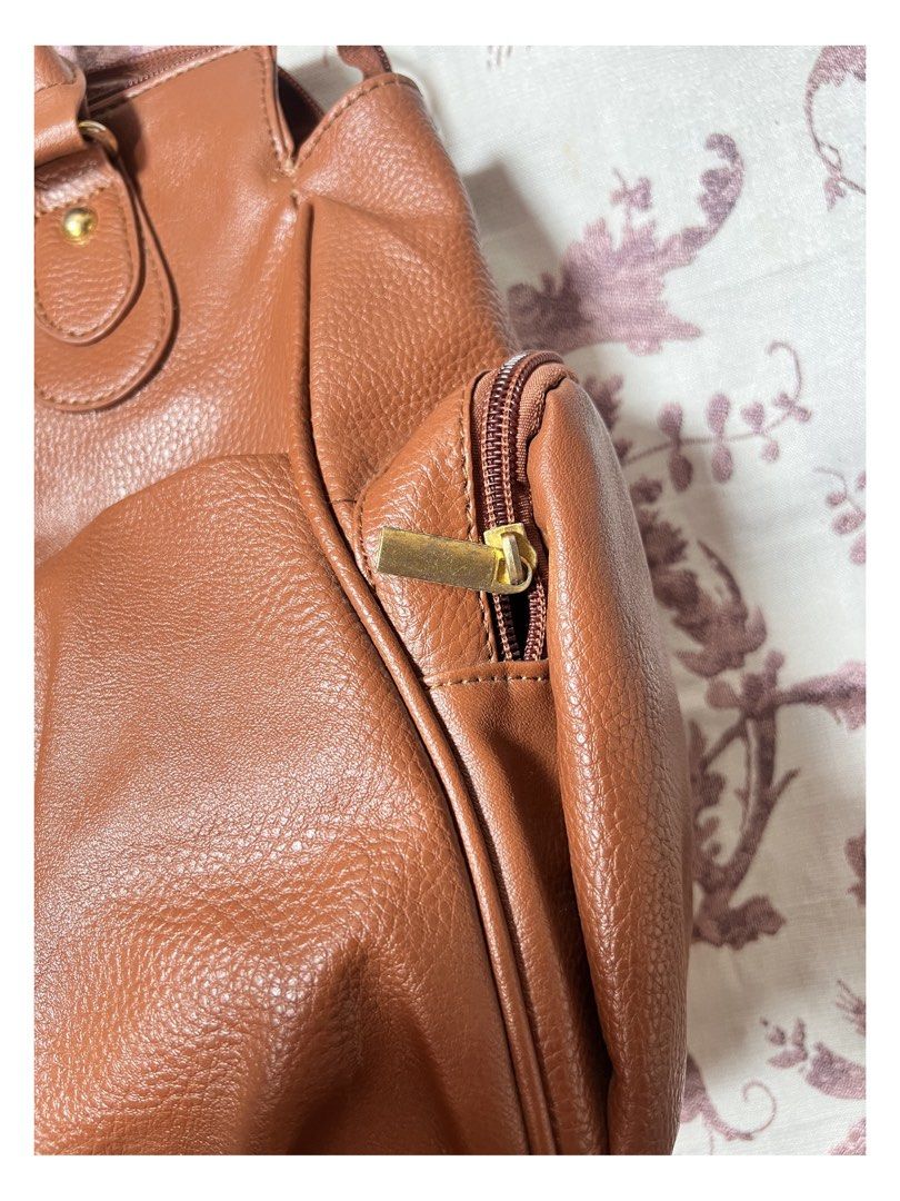 Brown Vintage Leather shoulder bag (Category: Tote Bags) located in Manila. Submitted by ashleyplum (Listing ID 1442323212, Image 2). Description: ~ no COD (payment first) ~ laguna based ~ JNT courier ~ color may vary due to lighting ~ no ww message for the details and more information 🪷.