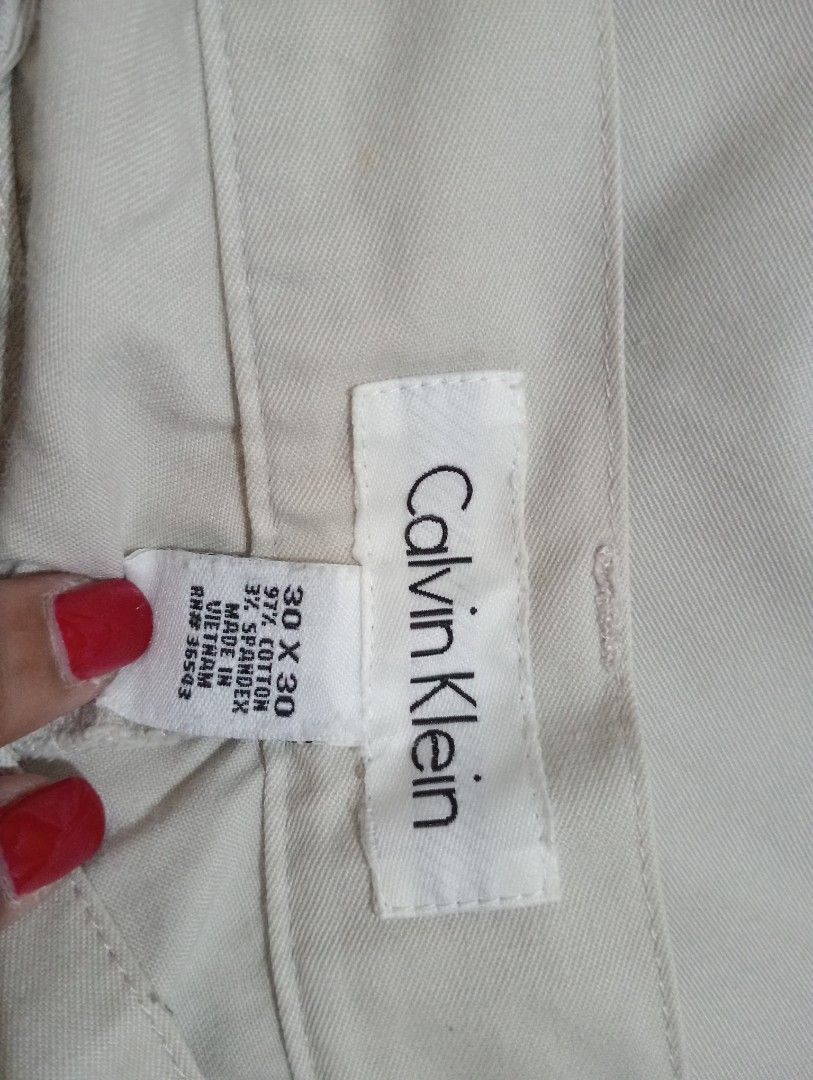 Calvin Klein Beige Chinos 30x30 (Category: Chinos) located in Makati City. Submitted by YSL80022 (Listing ID 1442234262, Image 2). Description: - Brand: Calvin Klein - Color: Beige - Size: 30 Waist, 30 Length - Material: Cotton blend with spandex for comfort - Origin: Made in Vietnam - Style: Versatile for casual or smart casual outfits RFS: weight gain.