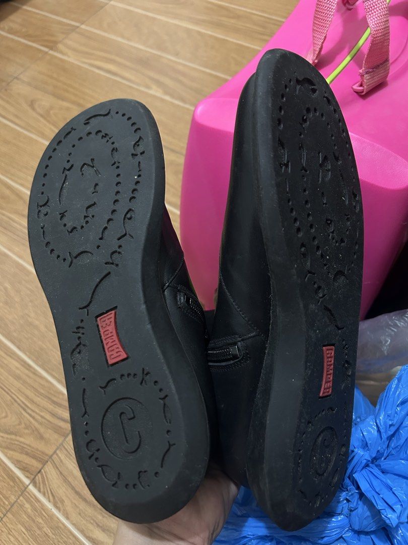 Camper Black Leather Ankle Boots Size 38 (Category: Boots) located in Quezon City. Submitted by SaskaEmilia (Listing ID 1442342219, Image 3). Description: - Brand: Camper - Type: Black Leather Ankle Boots - Size: 38 - Origin: Made in Portugal - Closure: Side zip - Condition: Uppers in good shape, some wear on soles - Features: Unique stitching detail on the front.