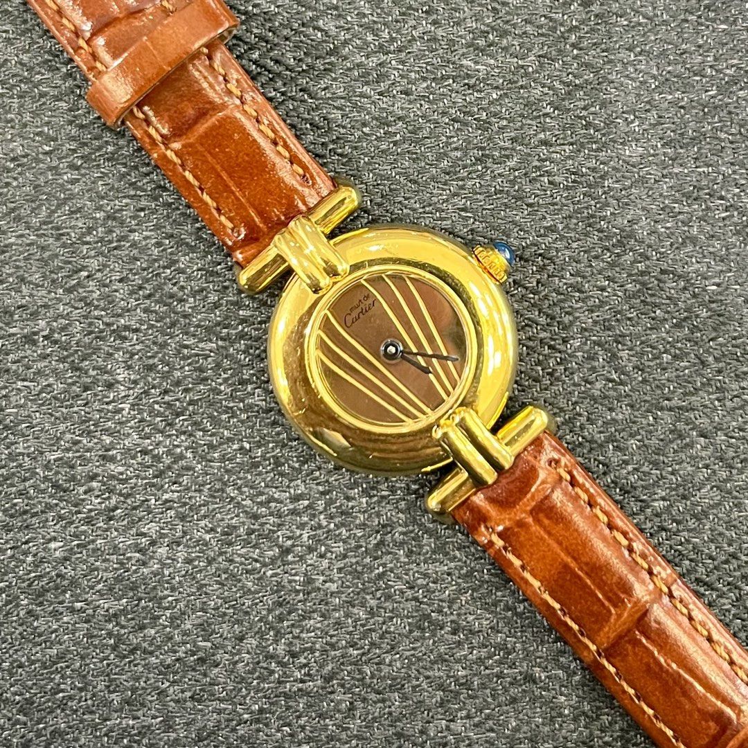 Cartier Must de Colisée (Category: Luxury Watches) located in Makati City. Submitted by the_ambitious_peasant (Listing ID 1442305105, Image 3). Description: - Authentic Cartier Must 23mm Watch - Vermeil Case (Silver plated with gold) - Swiss Quartz Movement - Brown Leather Strap - Signature Blue Cabochon Crown - Classic and Timeless Design - Ideal for Daily Wear - Swiss Made - 1996-1999 - Watch only .