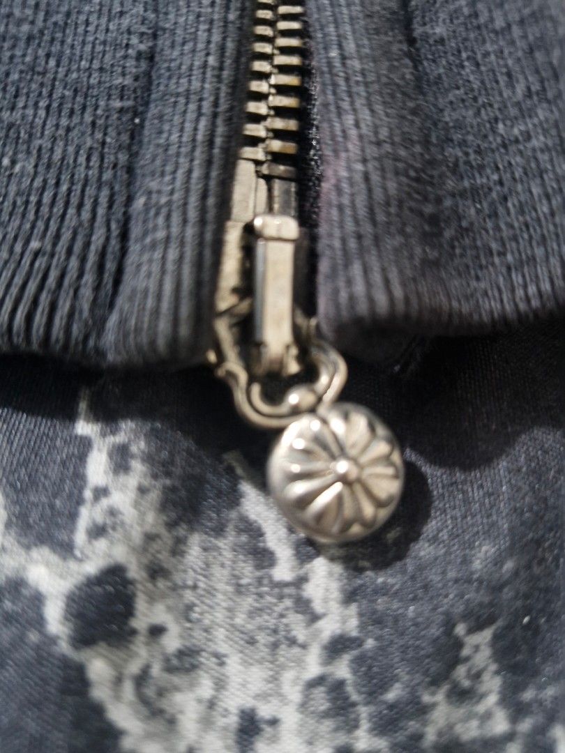 Chrome Hearts Black Zip-Up Hoodie (Category: Hoodies) located in Manila. Submitted by blackstarharpoon (Listing ID 1442324608, Image 3). Description: - Black zip-up hoodie - Features iconic Chrome Hearts cross embellishments on cuffs - Chrome Hearts logo on zipper pull - Comfortable and stylish - Ideal for layering NEGOTIABLE good for PSG.