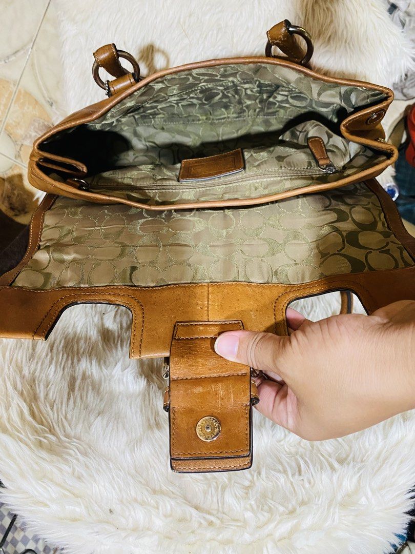 Coach hampton soho saddle brown flap bag (Category: Luxury Bags & Wallets) located in Real. Submitted by ynnagucci (Listing ID 1442159302, Image 3). Description: Missing 1 revit.. faded some parts of the leather..