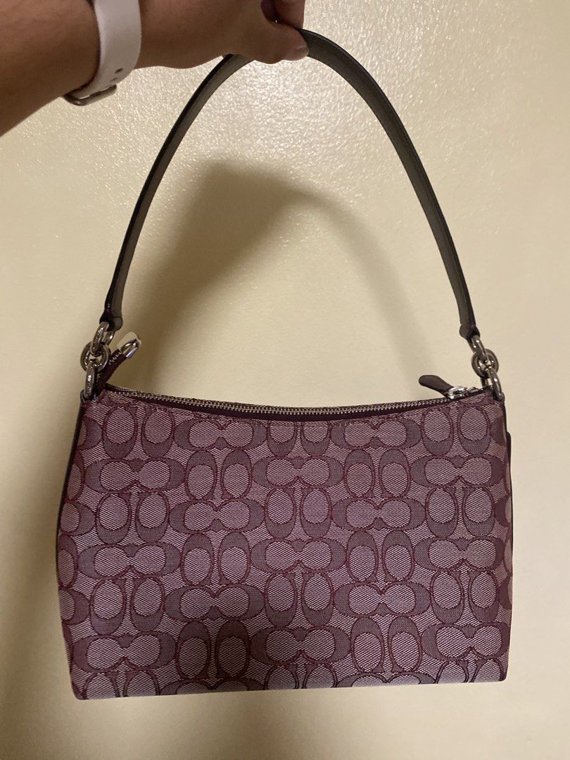 Coach Monogram Canvas Shoulder Bag Burgundy (Category: Luxury Bags & Wallets) located in Cavite. Submitted by prelovedclothesofzoe (Listing ID 1442319834, Image 2). Description: - Classic Coach monogram shoulder bag - Burgundy and beige colorway - Genuine leather trim and strap - Secure zipper closure - Small size, ideal for carrying essentials - Perfect for casual outings and everyday use.