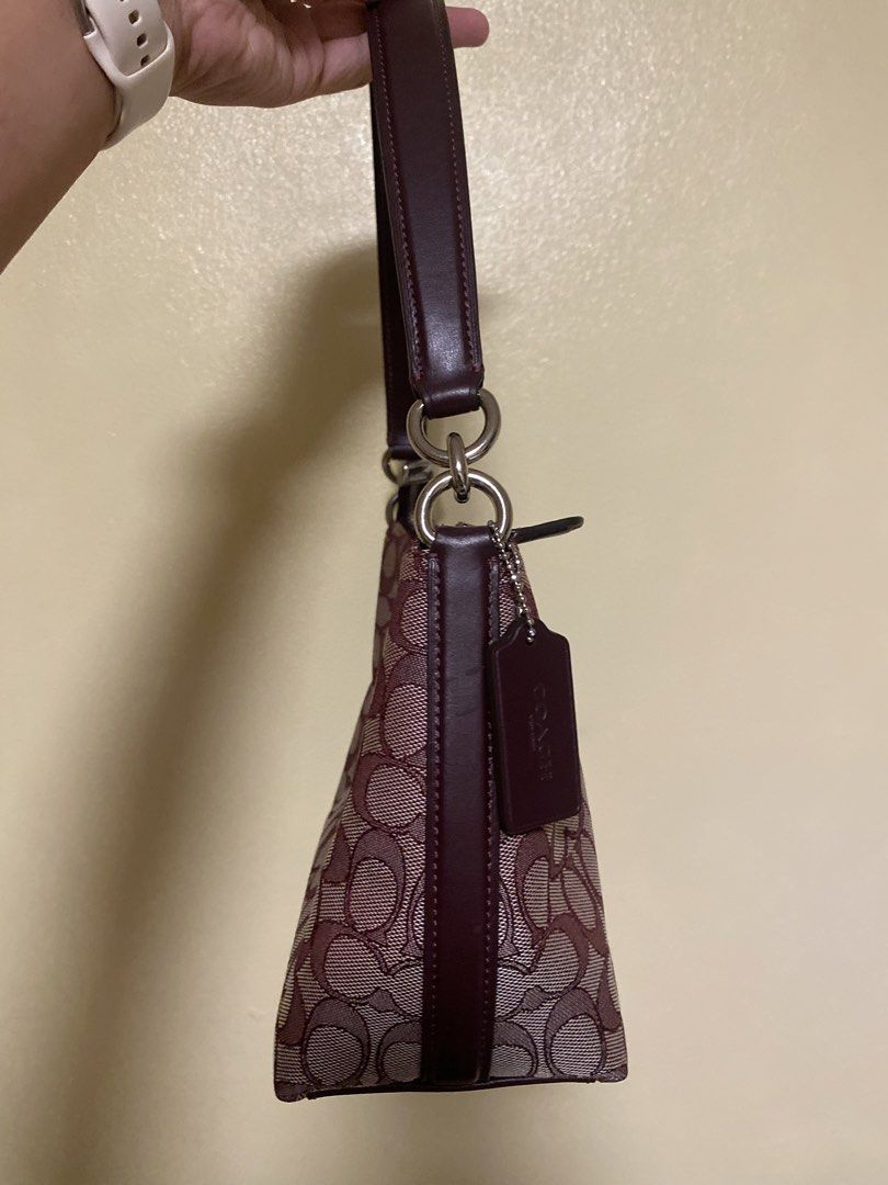 Coach Monogram Canvas Shoulder Bag Burgundy (Category: Luxury Bags & Wallets) located in Cavite. Submitted by prelovedclothesofzoe (Listing ID 1442319834, Image 3). Description: - Classic Coach monogram shoulder bag - Burgundy and beige colorway - Genuine leather trim and strap - Secure zipper closure - Small size, ideal for carrying essentials - Perfect for casual outings and everyday use.