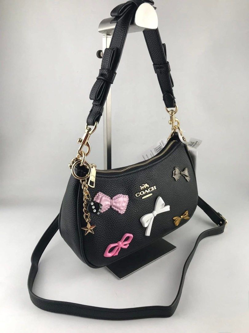 Coach Teri with bows & charms (Category: Luxury Bags & Wallets) located in Manila. Submitted by YSABELLE_MARGARETTE (Listing ID 1442205335, Image 3). Description: ONHAND! with tag, card, receipt, dustbag & paper bag j&t courier nationwide or lalamove around manila PAYMENT FIRST THRU GCASH!.
