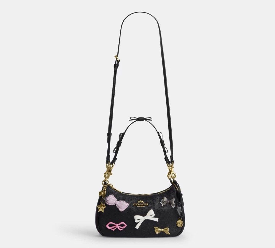 Coach Teri with bows & charms (Category: Luxury Bags & Wallets) located in Manila. Submitted by YSABELLE_MARGARETTE (Listing ID 1442205335, Image 1). Description: ONHAND! with tag, card, receipt, dustbag & paper bag j&t courier nationwide or lalamove around manila PAYMENT FIRST THRU GCASH!.
