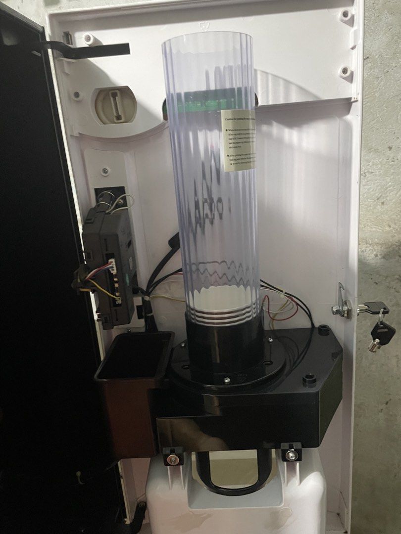 Coffee Vendo Machine Dosing Hoppers and Tubes (Category: Coffee Machines & Makers) located in Quezon City. Submitted by lanqcqc (Listing ID 1442189964, Image 3). Description: - Three dosing hoppers with connecting tubes - Likely for a commercial coffee machine - Features operational indicators: Mode Switch, Pull Handpiece Icon, Cleaning, and Cup Placement/Emptying.