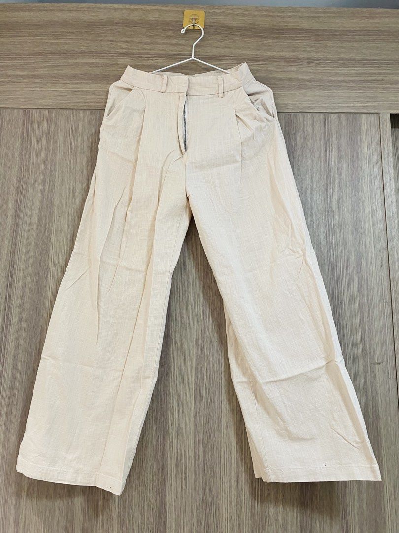 Cream Wide Leg Pleated Pants (Category: Other Bottoms) located in Pasay City. Submitted by shen220 (Listing ID 1442212557, Image 1). Description: - Cream colored wide leg pants - High-waisted with zipper closure -linen fabric .