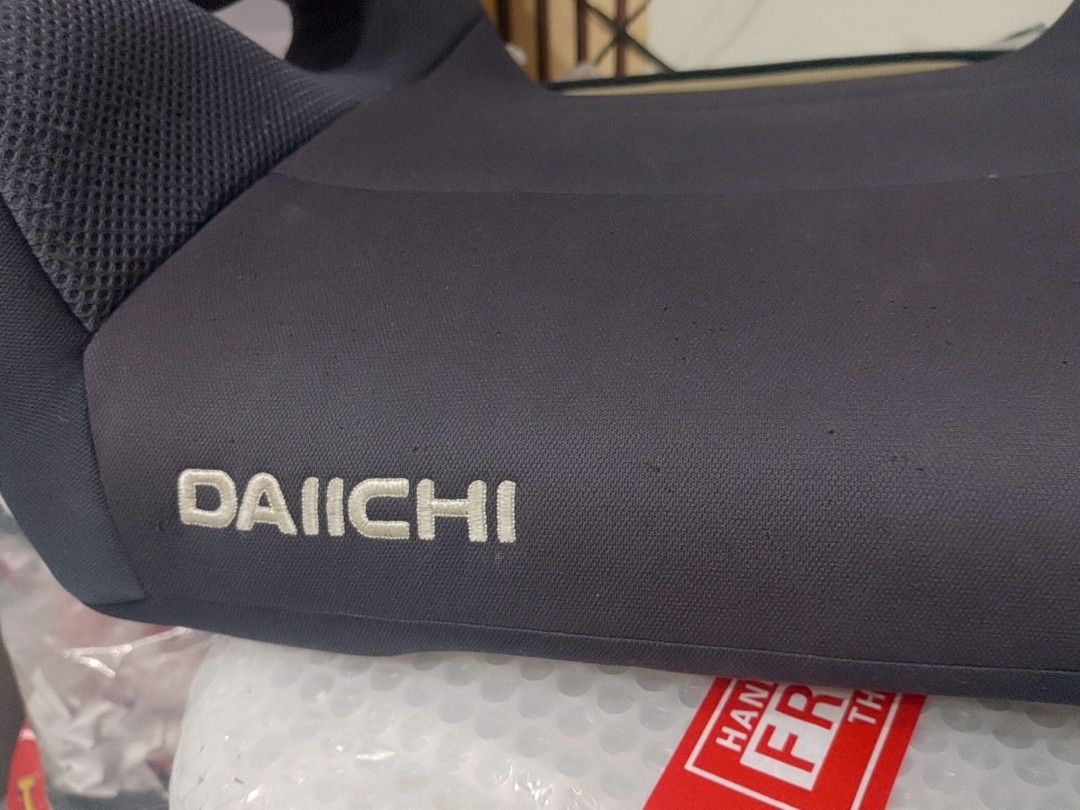 Daiichi Booster Car Seat (Category: Car Seats) located in Pasig City. Submitted by sweetchinchin15 (Listing ID 1442337185, Image 2). Description: - Daiichi booster car seat - Dark grey fabric with mesh accents - Padded armrests for comfort - Provides extra height for proper seatbelt positioning - Easy to install in most vehicles - Ideal for older children.