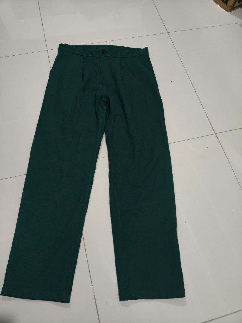 Dark Green Wide Leg Trousers (Category: Trousers) located in Quezon City. Submitted by affordable1 (Listing ID 1442304773, Image 1). Description: - Dark green wide-leg trousers - Front button and zip closure - Two side pockets - Belt loops on waistband waist 34 - Smooth fabric feel - Versatile for casual or smart casual outfits.