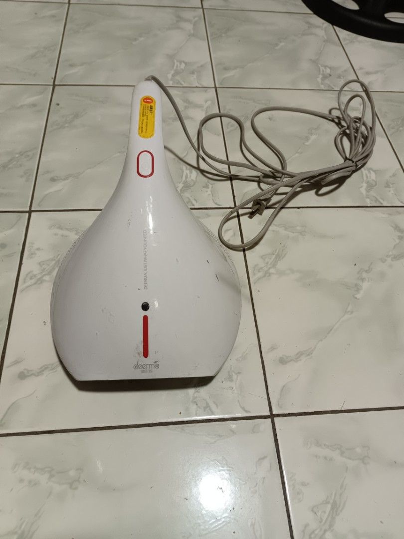 Deerma Handheld Vacuum Cleaner White (Category: Vacuum Cleaner & Housekeeping) located in Manila. Submitted by caaths_collection (Listing ID 1442336212, Image 2). Description: - Deerma handheld vacuum cleaner - Color: White - Power Source: Corded electric - Condition: Works well, with minor scuffs from use - Ideal for: Quick cleanups around the house - Feature: Easy to store.