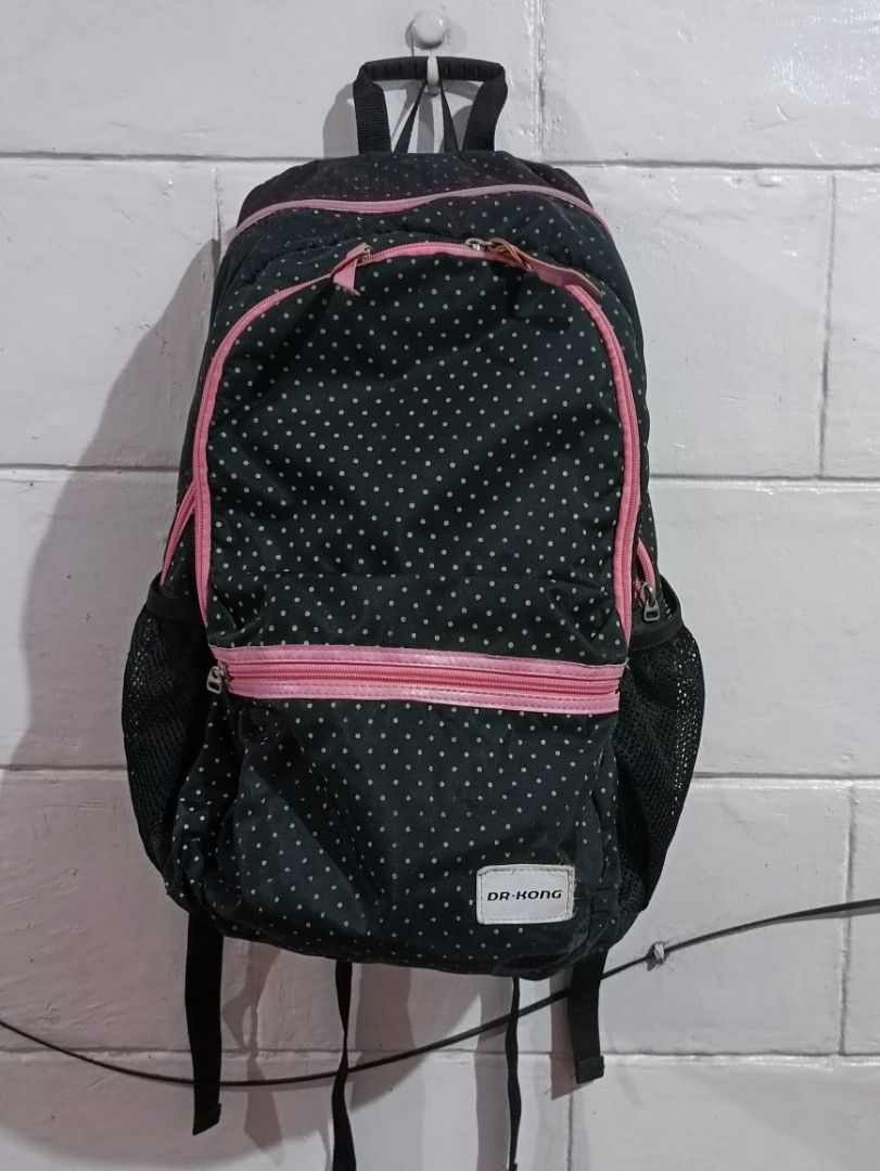Dr. Kong Black Polka Dot Backpack with Pink Trim (Category: Backpacks) located in Manila. Submitted by greatbrandsforless (Listing ID 1442159203, Image 1). Description: - Adorable black backpack with a fun white polka dot pattern. - Stylish pink trim and zippers add a pop of color. - Convenient side mesh pockets for your water bottle. - Comfortable padded straps on the back for easy carrying. - Multiple compartments inside to keep your belongings