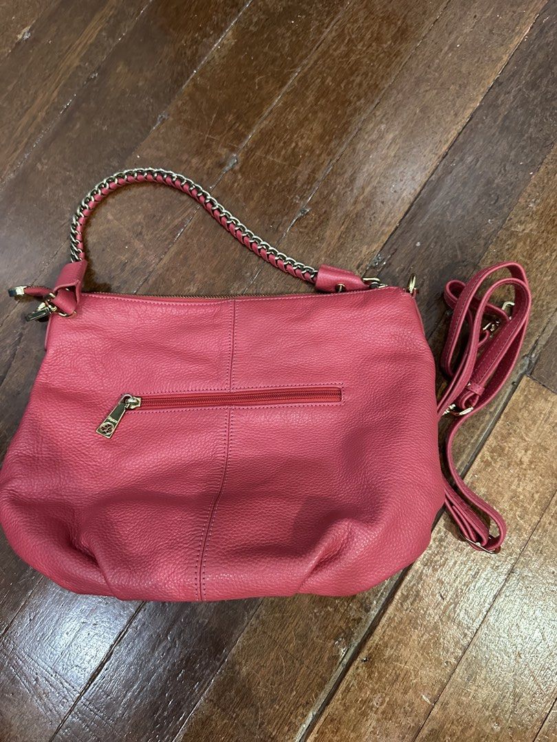 Elegance Pink Leather Shoulder Bag with Chain Strap (Category: Shoulder Bags) located in Del Monte. Submitted by bittersweetcigs (Listing ID 1442279777, Image 3). Description: - Pink leather shoulder bag by Elegance - Braided chain strap with leather accents - Top zipper closure - Back zipper pocket - Interior with patterned lining and logo patch - Detachable crossbody strap included - Ideal for everyday use.