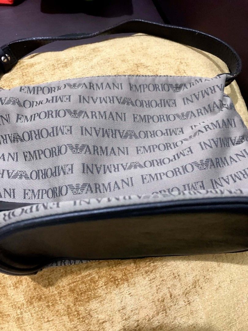 Emporio Armani Monogram Shoulder Bag (Category: Luxury Bags & Wallets) located in Makati City. Submitted by heinzly (Listing ID 1442167780, Image 1). Description: - Authentic Emporio Armani shoulder bag - All-over EA monogram print - Black leather trim and strap - Iconic silver eagle logo detail on the front - Interior branded tag - Made in Italy - Ideal for everyday use.