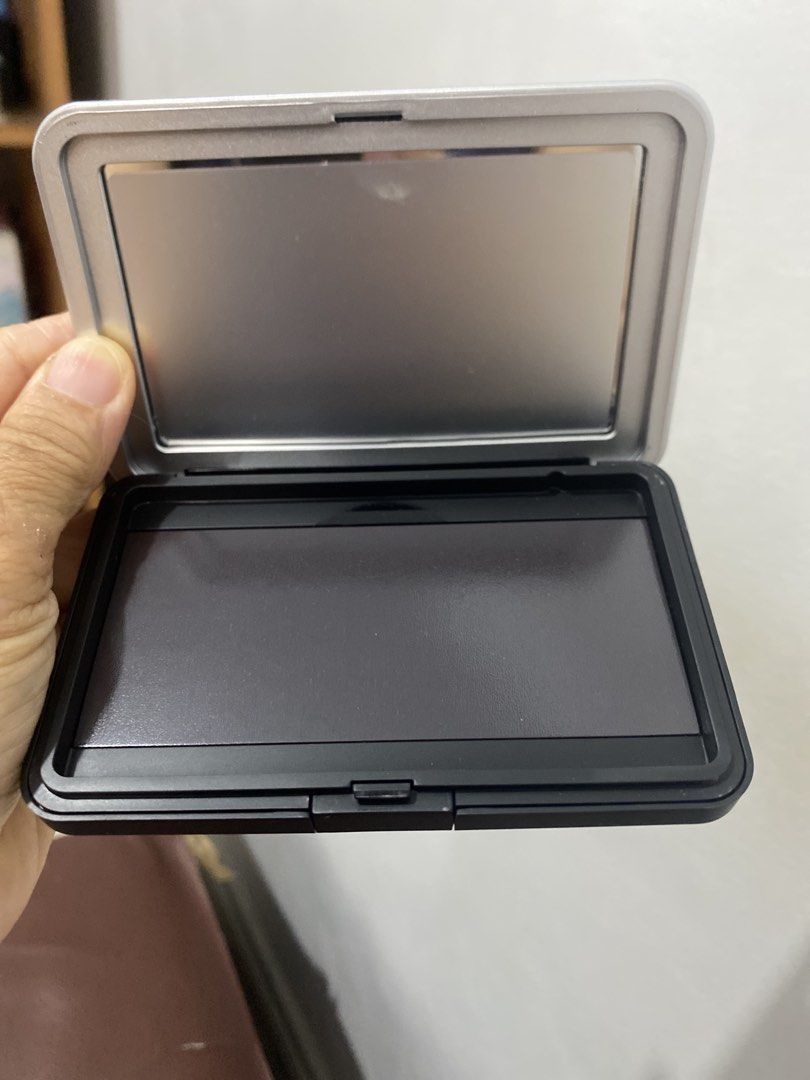Empty Makeup Palette with Mirror ( ₱ 120 each) (Category: Makeup) located in Muntinlupa City. Submitted by lay_away_ok (Listing ID 1442158662, Image 2). Description: - Empty black makeup palette with a built-in mirror. - Decorated with 'It Girl' and 'The Pretty Girl Mantra' stickers. - Ideal for creating your own custom eyeshadow or blush palettes. - Compact and portable for easy carrying. - Perfect for travel or daily touch-ups..