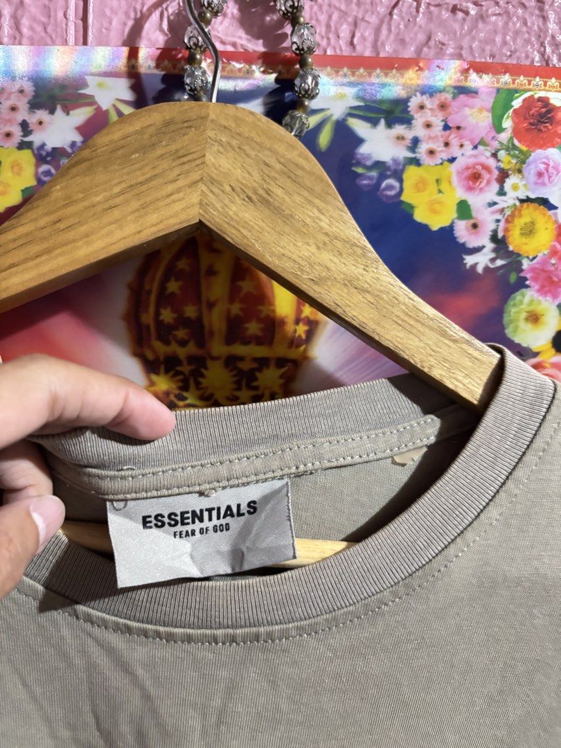 Fear of God Essentials T-Shirt Size L (Category: Tshirts & Polo Shirts ) located in Manila. Submitted by kobthrift.1223 (Listing ID 1442322325, Image 2). Description: - Essentials T-Shirt in Taupe - Classic Essentials logo on front - Rubberized logo patch on back - 100% Cotton - Tagged Size: L - Perfect staple piece for any wardrobe.