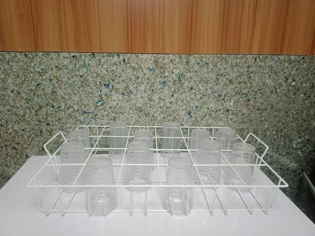 Glass Cup Rack (Category: Other Kitchenware & Tableware) located in Caloocan City. Submitted by moreventures_1024 (Listing ID 1442170128, Image 1). Description: - White wire cup rack - Designed for drying and storing glasses - Sturdy construction - Holds multiple cups - Ideal for kitchen organization.
