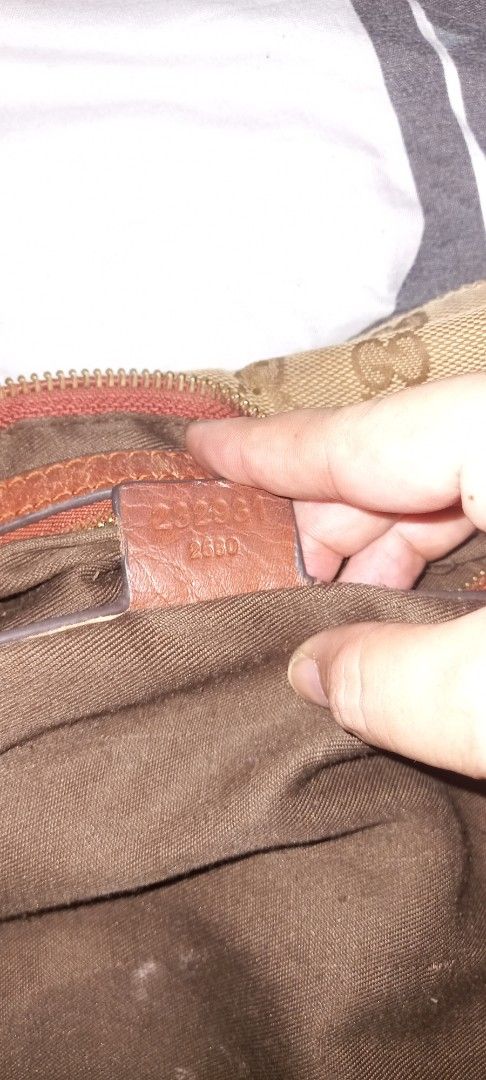 Gucci Monogram Canvas Hobo Bag (Category: Luxury Bags & Wallets) located in Cavite. Submitted by charisabla15249 (Listing ID 1442163727, Image 3). Description: - Authentic Gucci Hobo Bag - Classic GG Monogram Canvas - Leather Trim - Brown Fabric Interior Lining - Zipper Closure - Pre-loved, still has plenty of life left - Perfect for everyday use.