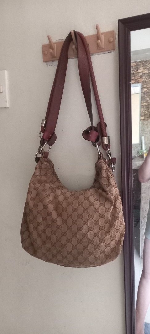 Gucci Monogram Canvas Hobo Bag (Category: Luxury Bags & Wallets) located in Cavite. Submitted by charisabla15249 (Listing ID 1442163727, Image 2). Description: - Authentic Gucci Hobo Bag - Classic GG Monogram Canvas - Leather Trim - Brown Fabric Interior Lining - Zipper Closure - Pre-loved, still has plenty of life left - Perfect for everyday use.