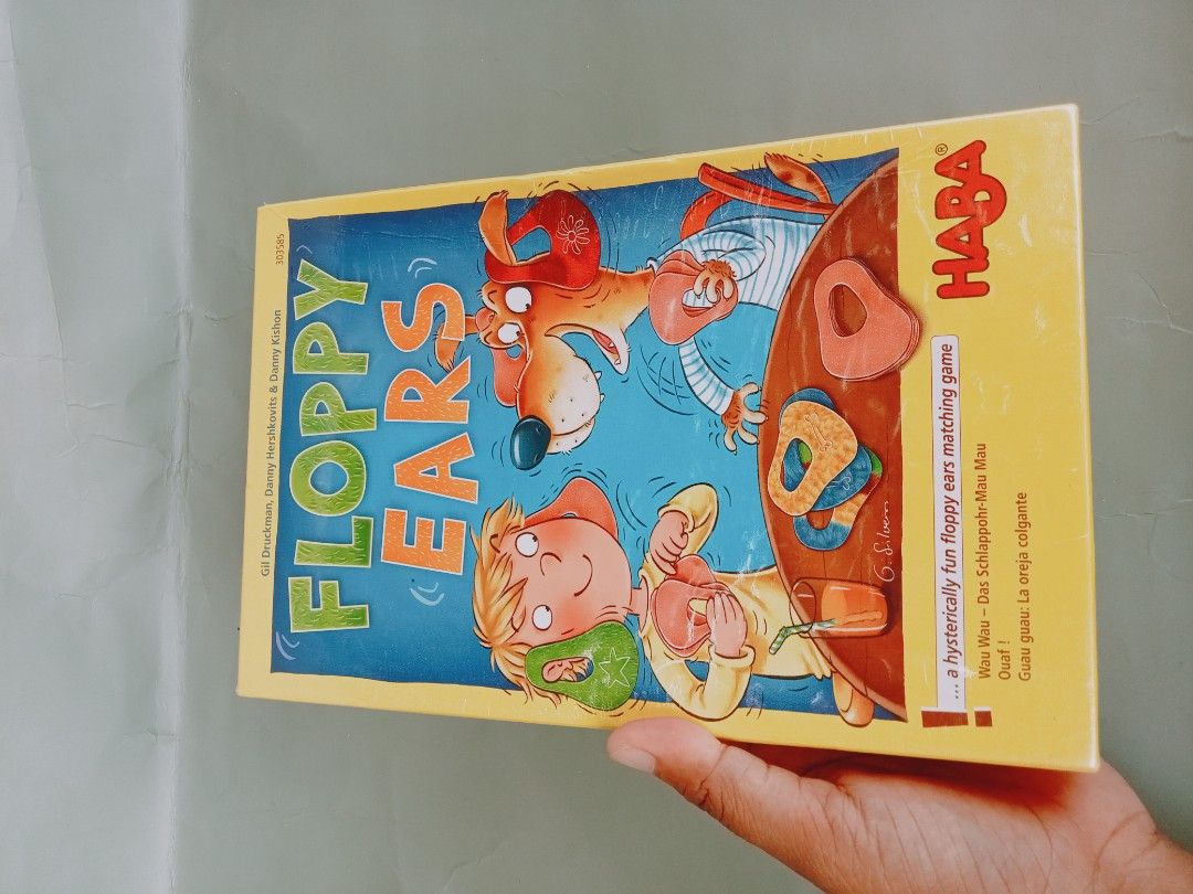 HABA Floppy Ears Matching Game (Category: Board Games & Puzzles) located in Rosario. Submitted by elysedeclutter (Listing ID 1442212303, Image 1). Description: - Fun matching game for kids by HABA: Floppy Ears - Develops memory and concentration skills - Suitable for 2-4 players - Recommended for ages 5 and up - Game time: approximately 18 minutes - Includes 16 ear cards - Perfect for family game nights or as a gift.