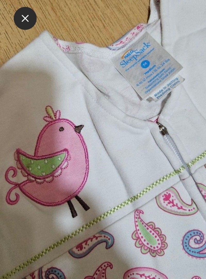 Halo SleepSack Wearable Blanket (Category: Babies & Kids Fashion) located in Cavite. Submitted by helpusdeclutter (Listing ID 1442162091, Image 2). Description: Halo SleepSack wearable blanket like new condition. used once only. bought in Urban Essentials. Size: Medium (fits babies 6-12 months, 16-24 lbs) Color: White with pink bird applique and paisley print SRP: P1,699. selling for only P800. Features: Easy front zipper for dressing Benefit: Pr