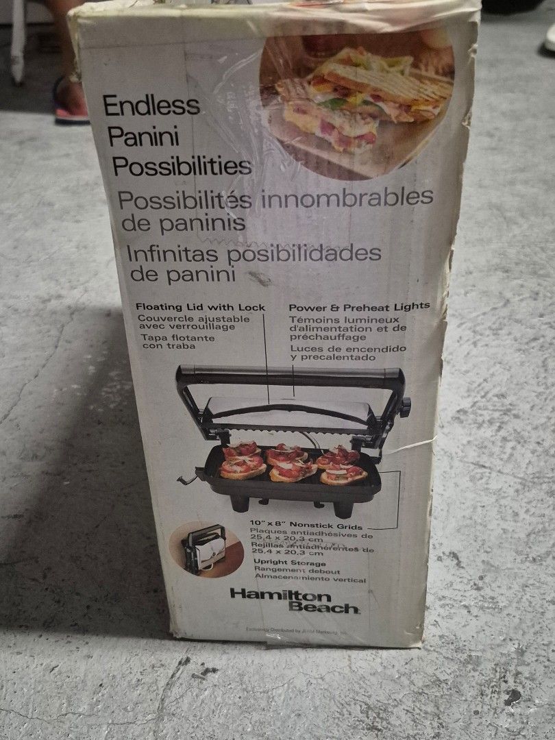 Hamilton Beach Panini Press Gourmet Sandwich Maker (Category: Cookware & Accessories) located in Taguig. Submitted by firesale123 (Listing ID 1442208765, Image 2). Description: - Hamilton Beach Panini Press - Grills sandwiches of any thickness - Floating lid adjusts for any size sandwich - 10" x 6" nonstick grids - Power & preheat indicator lights - Ideal for quick meals and snacks.