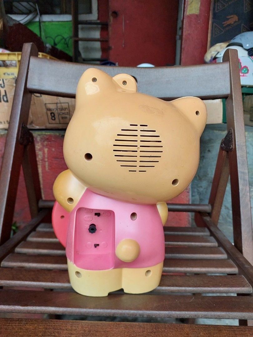 Hello Kitty Alarm Clock with Pink Bow and Flower (Category: Clocks) located in Quezon City. Submitted by jpnvintageonline (Listing ID 1442159868, Image 2). Description: - Vintage HELLO Kitty alarm clock - Features a cute pink bow and flower detail - Pink clock face with red hands - Battery operated - Perfect for any Kitty fan's room - Shows minor signs of wear on the plastic casing - NOT working.