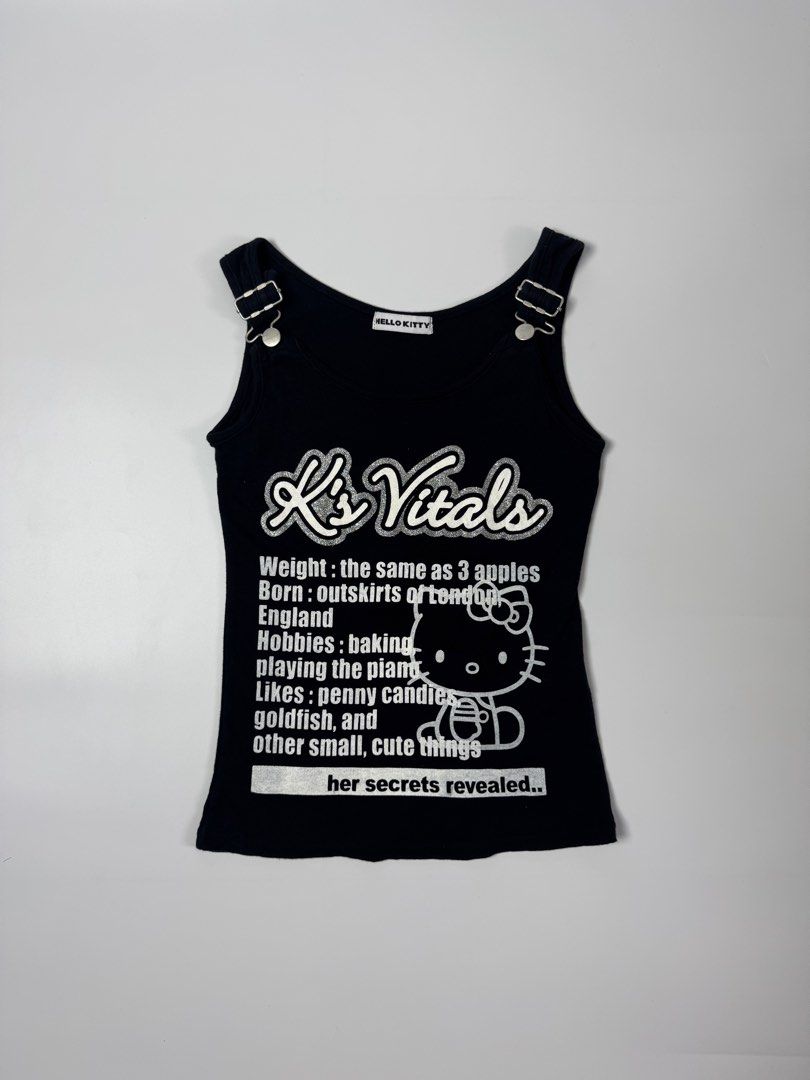Hello Kitty K's Vitals Black Tank Top (Category: Sleeveless) located in Manila. Submitted by babygirly2k (Listing ID 1442292723, Image 1). Description: - Cute black Kitty tank top - Features 'K's Vitals' graphic with Kitty details - Fun 'K's Vitals' info: Weight (3 apples), Born (outskirts of London), Hobbies (baking, piano), Likes (candies, goldfish, cute things) - Adjustable straps - 100% cotton.