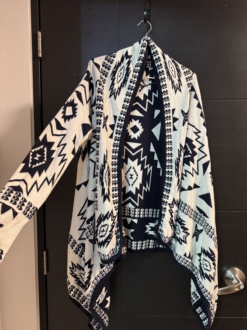 H&M Geometric Print Open Front Cardigan Sweater (Category: Coats, Jackets and Outerwear) located in Taguig. Submitted by ferrycat (Listing ID 1442279891, Image 1). Description: - Navy and white geometric print cardigan - Open front with draped waterfall hem - Long sleeves - Comfortable knit material - Ideal for layering over tops or dresses.