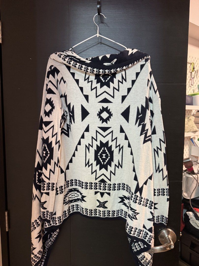 H&M Geometric Print Open Front Cardigan Sweater (Category: Coats, Jackets and Outerwear) located in Taguig. Submitted by ferrycat (Listing ID 1442279891, Image 3). Description: - Navy and white geometric print cardigan - Open front with draped waterfall hem - Long sleeves - Comfortable knit material - Ideal for layering over tops or dresses.