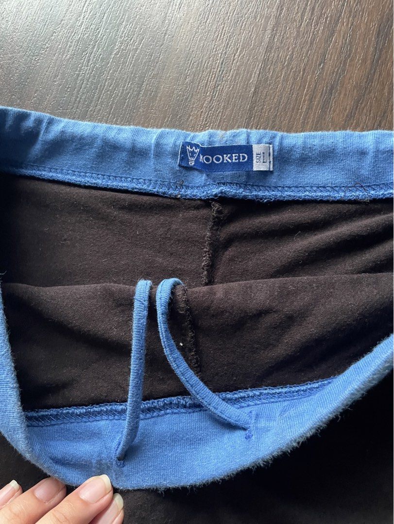 Hooked Black Mini Skirt with Blue Trim (Category: Skirts) located in Quezon City. Submitted by andreaaa_______ (Listing ID 1442178079, Image 3). Description: no size on tag second hand manage expectations some fade marks on waistband can be tightened with drawstring on the inside, wasitline in measurmenets is max waistline already has built in shorts .