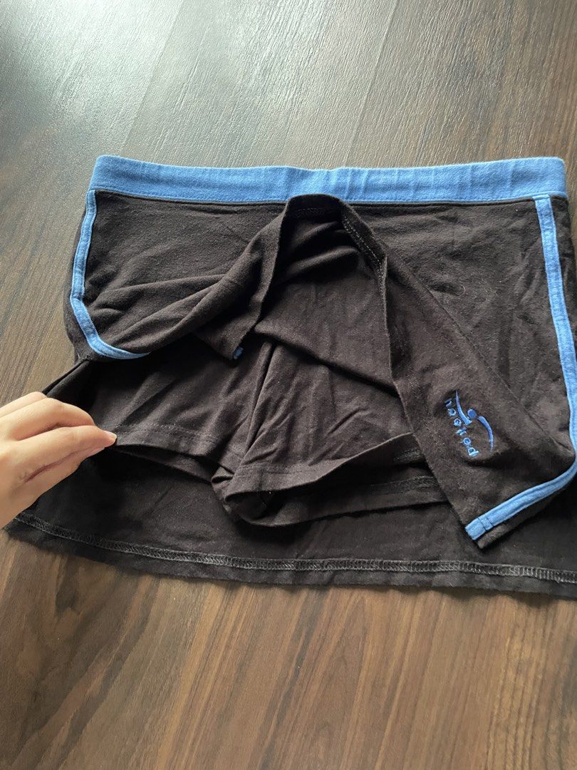Hooked Black Mini Skirt with Blue Trim (Category: Skirts) located in Quezon City. Submitted by andreaaa_______ (Listing ID 1442178079, Image 2). Description: no size on tag second hand manage expectations some fade marks on waistband can be tightened with drawstring on the inside, wasitline in measurmenets is max waistline already has built in shorts .