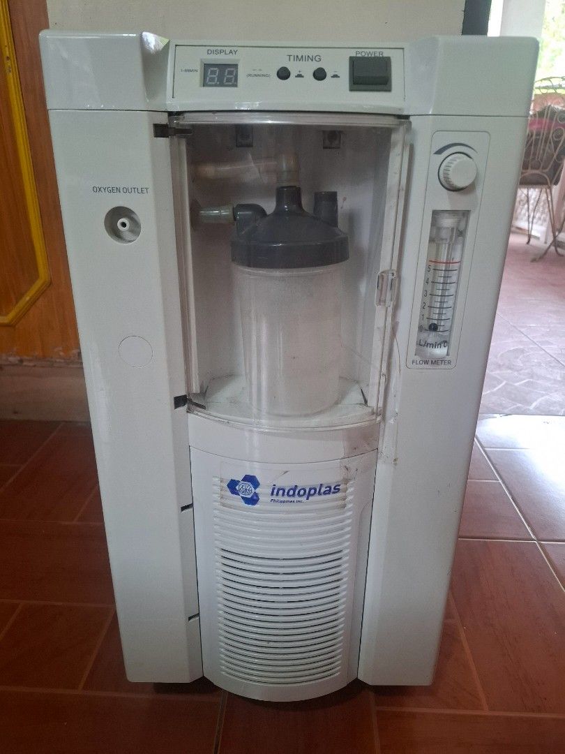 Indoplas Oxygen Concentrator (Model OXY-102) (Category: Medical Supplies & Tools) located in Morong. Submitted by cochisee (Listing ID 1442193476, Image 1). Description: ✅️Adjustable oxygen flow rate up to 5 L/min ✅ Built-in humidifier bottle ✅ Digital timer/display function ✅ Compact design with caster wheels for easy mobility ✅ Low power consumption (400W) ✅ 220V, 60Hz operation ✅ Oxygen outlet ready for tubing.