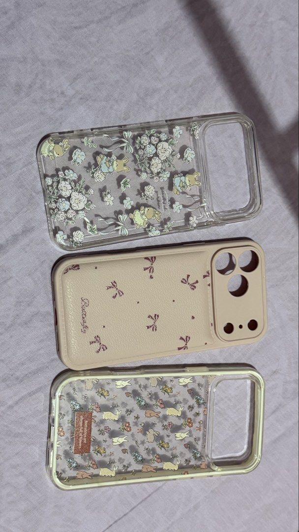 iPhone 17 Pro Max Cases (Category: Cases & Sleeves) located in Valenzuela. Submitted by prelovedbyaby03 (Listing ID 1442314141, Image 1). Description: iPhone 17 Pro Max Cases Pink - Never used Clear w/ cream - Never used Clear - used once 100 each or take all for 200.