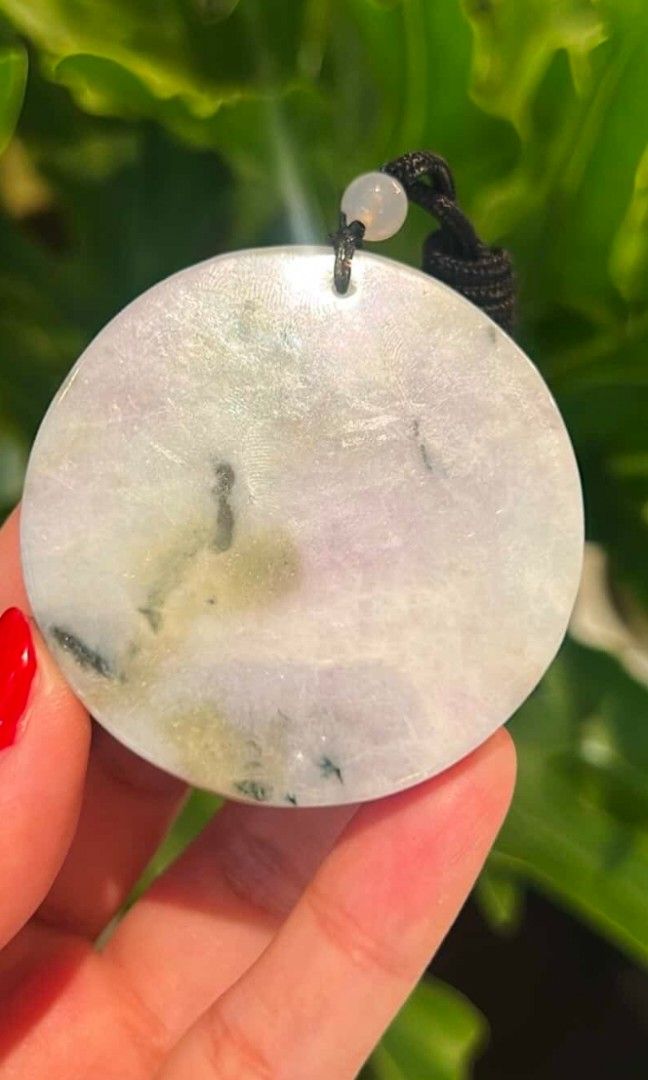 Jadeite Purple and Green Pendant (Category: Necklaces) located in Taguig. Submitted by c_rivera (Listing ID 1442234835, Image 2). Description: Front carving, Koi, Lotus. Purple with green color. Transluscent and very jelly. Has a brown rope necklace and will come with a stand to display while not being worn. very nice piece. letting go because I have another one I like better and jade is better when used often! for protection, balance, wealth and