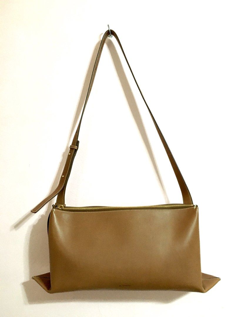Jil Sander Brown Leather Shoulder Bag (Category: Luxury Bags & Wallets) located in Bacoor. Submitted by pbmypet (Listing ID 1442195486, Image 2). Description: - Authentic Jil Sander brown leather shoulder bag - Comes with original dust bag and shopping bag - Interior is clean and well-maintained - Adjustable strap for comfortable wear - Ideal for everyday use Jil Sander Empire Small-sizes leather handbag - PRICE NEGOTIABLE - ISSUE: NONE - FLAWS: 